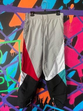 Converse colorblock track pants with red, white, teal and black panels
